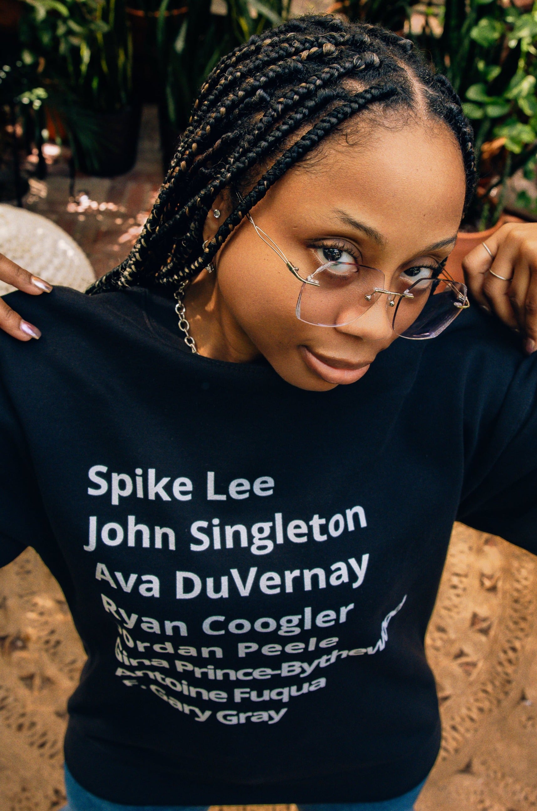 t-shirt with minimalist typography listing black filmmakers and cinema directors: Spike Lee, John Singleton, Ava DuVernay, Ryan Coogler, Jordan Peele, Gina Prince-Bythewood, Antoine Fuqua, F. Gary Gray